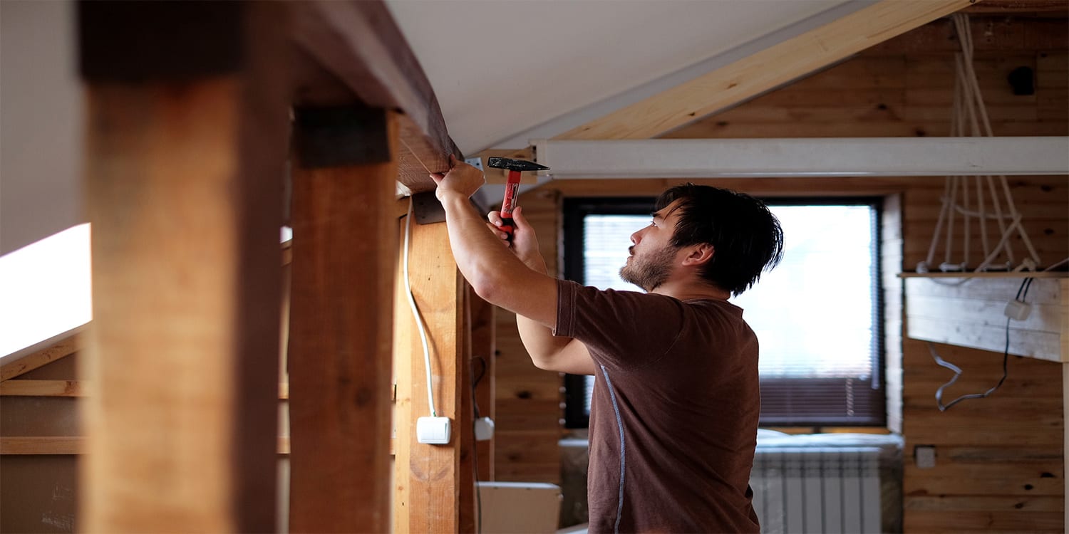 Man working on renovations during house flip